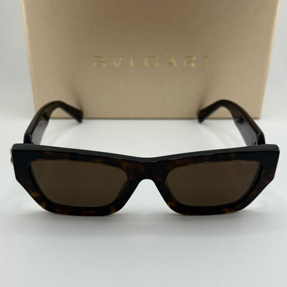 Bvlgari square sunglasses with a dark tortoiseshell frame and dark brown lenses, displayed in front of their beige Bvlgari brand box.
